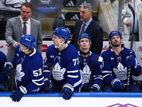 Gavin McKenna of the Toronto Maple Leafs looks on from the bench during the third period against the Buffalo Sabres.
