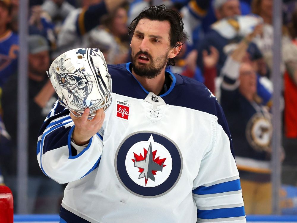Connor Hellebuyck of the Winnipeg Jets reacts against the St. Louis Blues during a game last year.