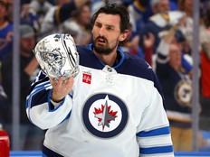 Connor Hellebuyck of the Winnipeg Jets reacts against the St. Louis Blues during a game last year.