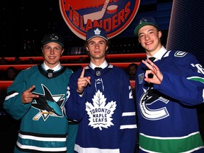 From left: Ivar Stenberg of the San Jose Sharks, Gavin McKenna of the Toronto Maple Leafs, and Caleb Malhotra of the Vancouver Canucks pose for a picture during day one of the 2026 NHL Draft on June 26, 2026 in Buffalo.