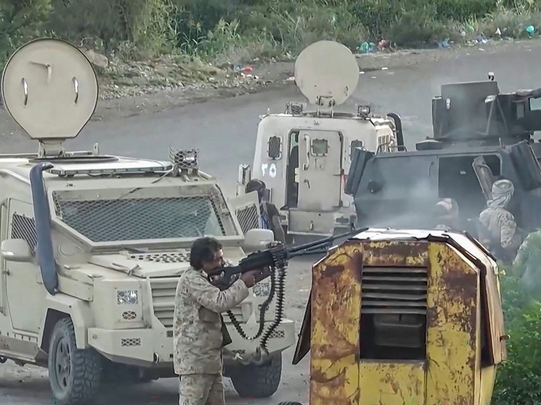 This screen grab taken from video footage released by Ansarullah Media Centre on October 7, 2026 shows a fighter affiliated with the Houthi authorities firing his machine gun as they advance against Saudi-backed Yemeni government troops in Taiz Governorate, according to Houthi media. Saudi authorities said on October 7 three people were killed in attacks on two of the kingdom's international airports, including in the capital Riyadh, after Yemen's Houthis claimed to have fired on both transport hubs. The Iran-backed Houthi authorities have claimed a wave of attacks on Saudi civilian infrastructure in recent weeks, which came as Riyadh-backed forces pressed a counter-offensive against the group's territorial gains.
