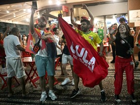 Supporters of Brazil presidential candidate Luiz Inacio Lula da Silva celebrate after the results of the presidential runoff.