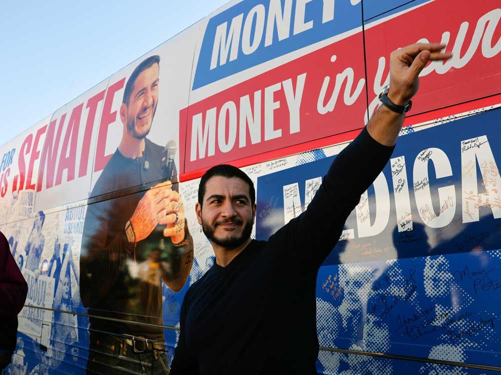 Abdul El-Sayed, U.S. Democratic Senate candidate from Michigan, waves to supporters near his campaign bus after a rally in Flint, Mich., on Oct. 18, 2026.