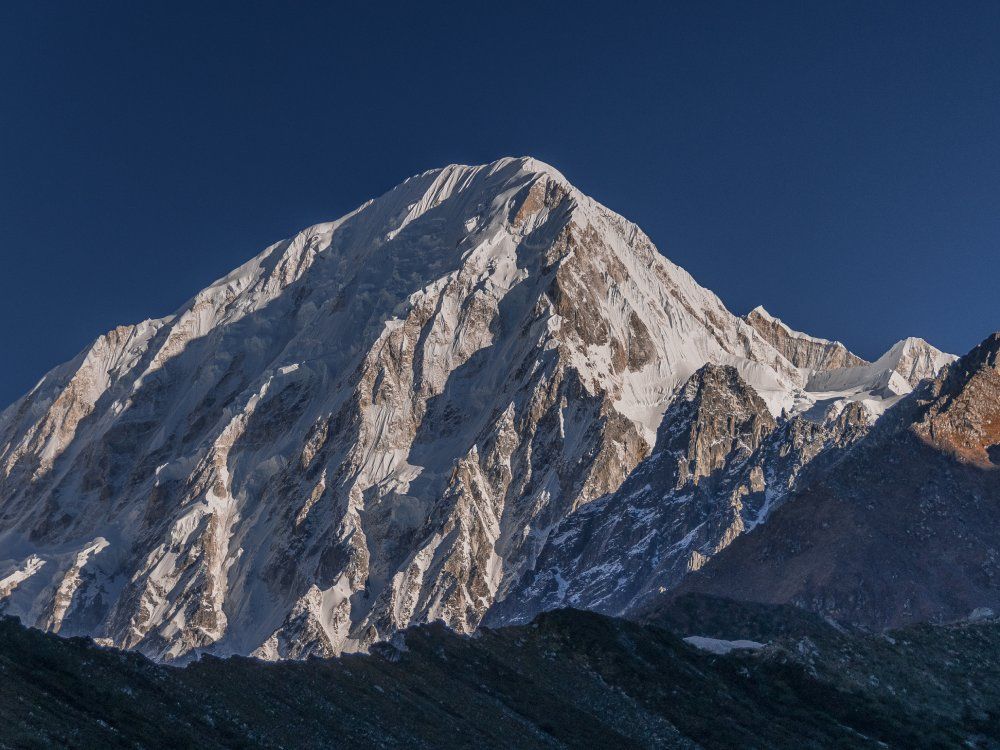 Cheo Himal & Himlung Himal stunning summits on Nepal-Tibet border as seen on descent from Larkya La pass to Bimtang village, Manaslu Circuit trek, Manaslu Himal, Gorkha district, Nepal Himalaya.