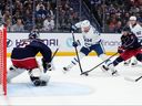 Auston Matthews #34 of the Toronto Maple Leafs shoots the puck against Jet Greaves #73 of the Columbus Blue Jackets while Denton Mateychuk #5 of the Columbus Blue Jackets defends during the first period on Tuesday.