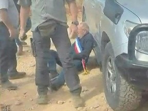 This screen grab made from the UGC footage obtained on October 17, 2026, shows a man wearing a blue, white and red sash, of the type used by French public officials, leaning against a vehicle as masked men intercept and surround a car carrying activists in the Christian village of Taybeh, in the Israeli-occupied West Bank. Bottom: Bernard Baudoux, mayor of the northern French town of Aulnoye-Aymeries.