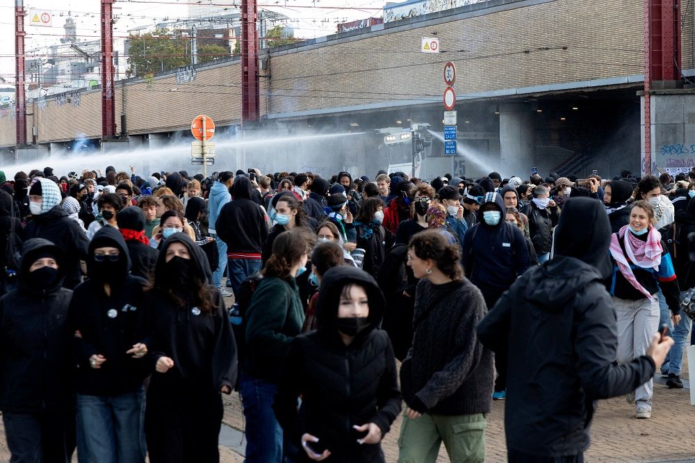 Riot police uses a water cannon as demonstrators gather during a youth protest in Brussels on October 17, 2026.
