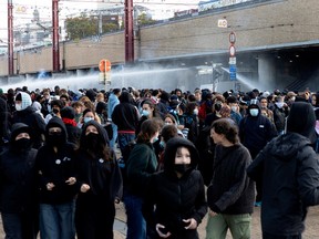 Riot police uses a water cannon as demonstrators gather during a youth protest in Brussels on October 17, 2026.