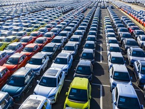 many cars parked in straight lines