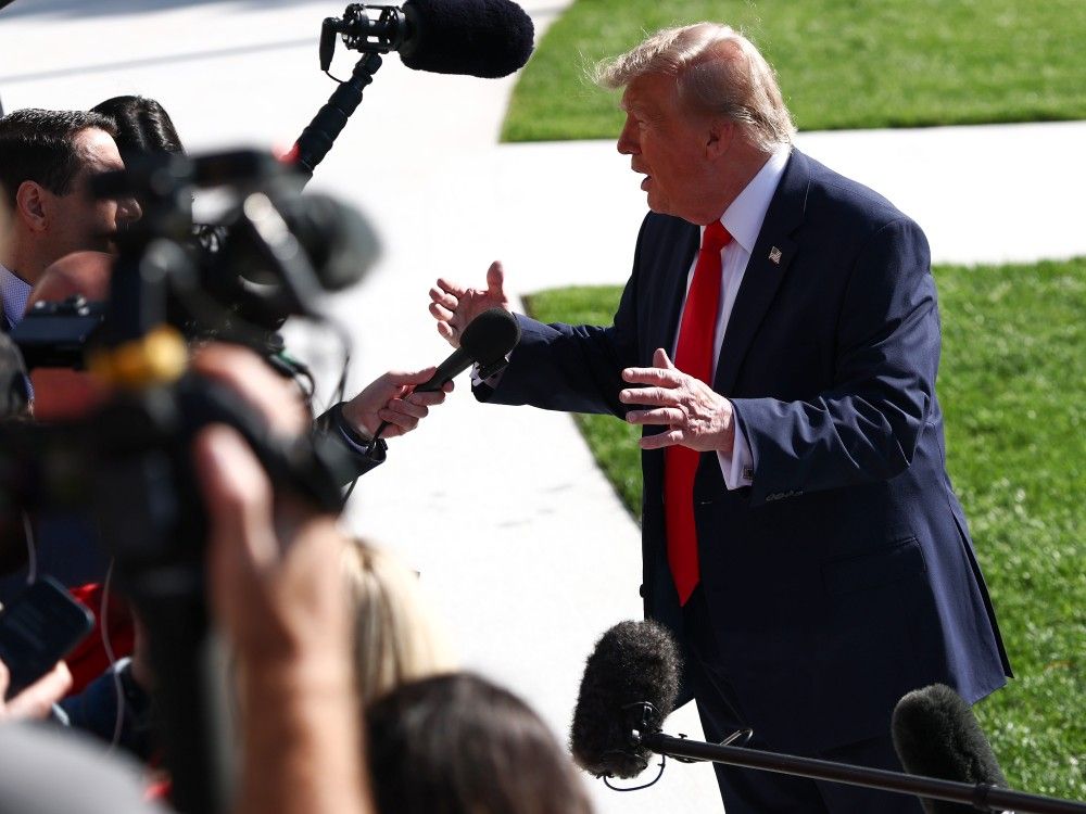 U.S. President Donald Trump stops to speak to members of the media as he departs on the South Lawn of the White House in Washington, D.C., Friday, Oct. 23, 2026.