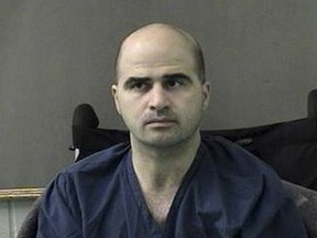 This April 9, 2010 file photo released by the Bell County Sheriffs Department, shows US Major Nidal Hasan after being moved from Brooke Army Medical Center in San Antonio to Bell County Jail in Belton, Texas.