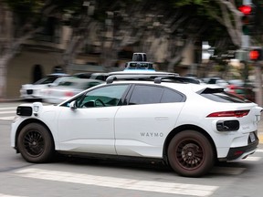 A Waymo robotaxi drives in North Beach on July 07, 2026 in San Francisco, California.