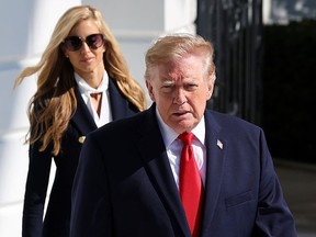 White House Press Secretary Katie Zacharia (L) joins U.S. President Donald Trump as he departs on the South Lawn of the White House on October 13, 2026 in Washington, DC.