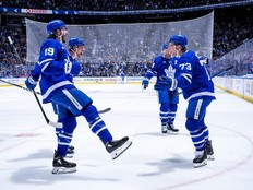 Teddy Blueger of the Toronto Maple Leafs celebrates a goal with his teammates.