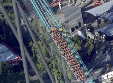 In this screengrab from WXIA, TV in Atlanta, workers try to get riders off the Goliath roller coaster at Six Flags Over Georgia.