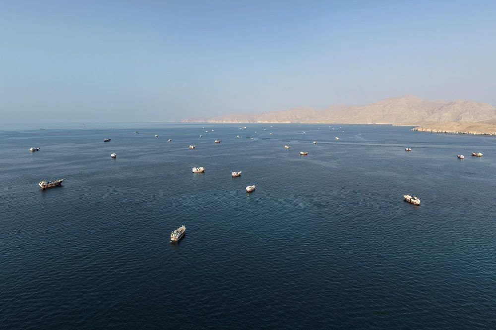 An aerial view shows ships anchored off the coast of Khasab in Oman's Musandam Governorate, near the Strait of Hormuz.