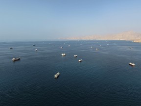 An aerial view shows ships anchored off the coast of Khasab in Oman's Musandam Governorate, near the Strait of Hormuz.
