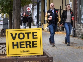 Toronto mayoral candidate Brad Bradford and his wife Kathryn Randle arrive for Randle to cast her vote.