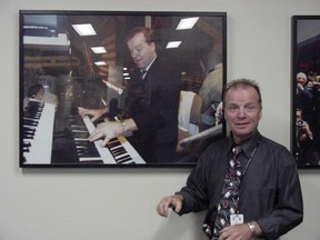 Jimmy Holmstrom stands next to a portrait of himself at the Air Canada Centre. SUPPLIED PHOTO