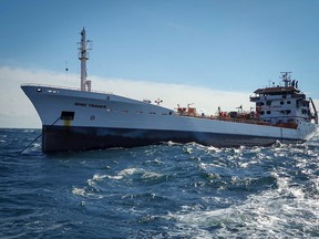 A handout picture made available by The Romanian Agency for Saving Human Life at Sea (ARSVOM) shows "Wine trader" ship in the territorial waters of Romania near Sulina, on October 15, 2026. Romanian President Nicusor Dan said drone attacks on vessels in the Black Sea were "unacceptable" and must stop, after two ships were struck off the country's coast, spillover from Russia's war with Ukraine.