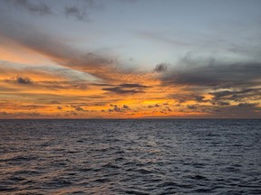 Sunset on the South Pacific, about 12 nautical miles from Nikumaroro, and an expedition that promises to shed light on the disappearance of Amelia Earhart