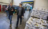Daily Bread Food Bank CEO Neil Hetherington (left) shows Conservative Party Leader Pierre Poilievre around the facility during a visit to the Daily Bread Food Bank in the Etobicoke area of Toronto on Friday April 19, 2024.