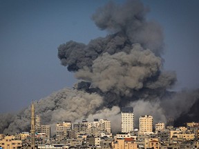 Smoke billows during Israeli air strikes in Gaza City