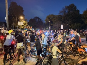 Cyclists gather in the area of Bloor St. W. and Islington Ave.