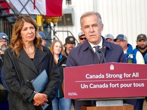 Alberta Premier Danielle Smith looks on while Prime Minister Mark Carney speaks during an announcement that the Pacific Link has been listed as a project of national interest, in Fort McMurray, Alta. on Thursday, Oct. 1, 2026