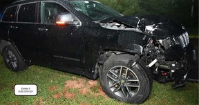 A damaged Jeep Grand Cherokee is pictured in a photo released in a new court filing.