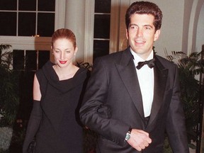In this file photo taken on Feb. 5, 1998 John F. Kennedy Jr. and his wife Carolyn Bessette Kennedy arrive at the White House for a state dinner in honour of British Prime Minister Tony Blair and his wife Cherie.