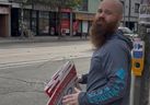 Images of a man holding folded-up election signs at the corner of Islington Ave. and Lake Shore Blvd. were shared over social media on Thanksgiving weekend.