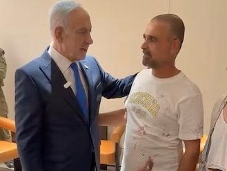 Israeli Prime Minister Benjamin Netanyahu meeting with one of the flydubai hero passengers, Yaniv Hayun. 