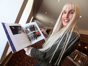 Darcie von Axelstierna, chairwoman of the Manitoba branch of the Monarchist League of Canada, holds a royal commemorative book in Winnipeg on Thursday, April 28, 2011, given away during a party celebrating Friday's royal wedding. (MARCEL CRETAIN, Winnipeg Sun)
