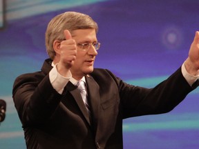 Prime Minister Stephen Harper enters the Telus Convention Centre in Calgary on Monday May 2, 2011 for his post-election appearance. (LYLE ASPINALL/QMI AGENCY)