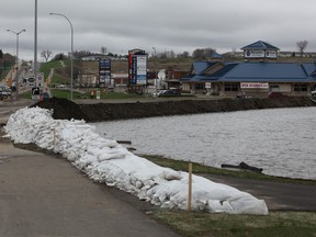A row of sandbags protect the city of Brandon, Manitoba as the waters of the Assiniboine River rise Monday, May 9, 2011.