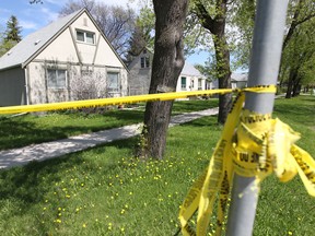 Police are investigating the May 14, 2011 death of a Winnipeg woman as a homicide. This house in the 1000 block of Edderton Avenue was sealed with police tape Wednesday. (CHRIS PROCAYLO/Winnipeg Sun)