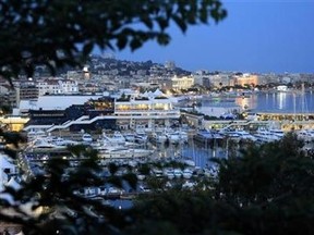 A general view shows the Festival Palace and boats moored in the harbour of Cannes, before the start of the 64th Cannes Film Festival in Cannes, May 9, 2011. (Reuters/Jean-Paul Pelissier)