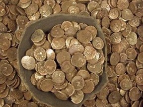 Pictured is a hoard of Iron Age gold coins found in Suffolk, southeast England in 2008. Britain is bursting with ancient buried treasure and the masses have been bitten by the bug for digging it up. (REUTERS/Portable Antiquities Scheme/Handout)