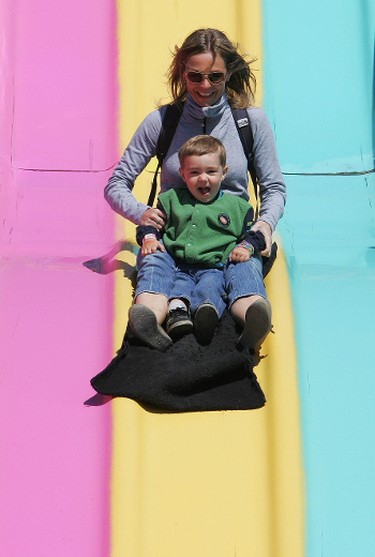 Tania Elliott and her son Milo Elliott, 2, ride the super slide during the Rainmaker Rodeo in St. Albert, Saturday May 28, 2011. (DAVID BLOOM/EDMONTON SUN)