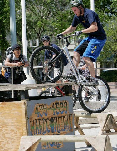 Aaron Dobler jumps from one obstacle to another during an Observed Trials bicycle demonstration at Edmonton's Bikefest in Churchill Square, Sunday May 29, 2011. (DAVID BLOOM/EDMONTON SUN)