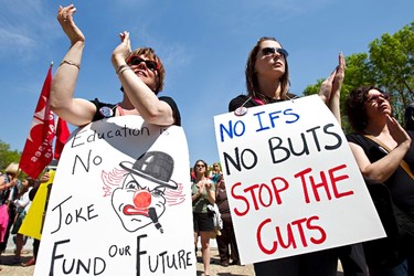 Hanya Bahniuk, left, and Daria Bahniuk, both teachers at Holyrood School, protest staff cuts in the school system during a rally at the Alberta Legislature in Edmonton on Sunday, May 29, 2011. (CODIE MCLACHLAN/EDMONTON SUN)