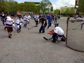 Ecstatic fans play street hockey at The Forks following the announcement of the NHL's return to Winnipeg last Tuesday. Many fans want the team to be named the Winnipeg Jets. (Bernice Pontanilla/WINNIPEG SUN FILES)
