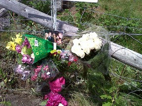 A roadside memorial was set up on Sunday at the intersection of Woodroffe Ave. and Longfields Dr. where Tony Adamo, 21, died after crashing his motorbike early Saturday. KELLY ROCHE/OTTAWA SUN