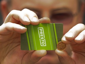 Allen Castaban, 52, shows his Metrolinx Presto card. The cards, currently in use in Toronto, are coming to Ottawa in 2012. (Jack Boland / Toronto Sun / QMI Agency)