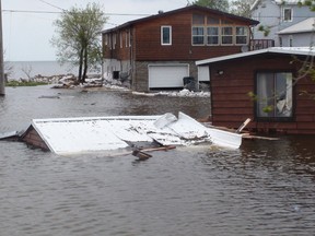The most severely flood-damaged houses and cottages at Twin Lakes Beach, about 90 km northwest of Winnipeg, appear to have been shaken by an earthquake, smashed by boulders or simply flattened. (ROSS ROMANIUK/Winnipeg Sun)