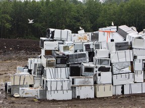 Piles of fridges and freezers collected from Slave Lake, Alta., stacked up in the landfill. Edmonton will take fridges and other big items from citizens in its big bin event. (AMBER BRACKEN/EDMONTON SUN)