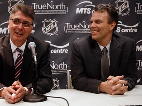 Jets coach Claude Noel and GM Kevin Cheveldayoff (right). (DAVE ABEL/QMI Agency)