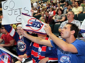 Winnipeg Jets fans at MTS Centre cheer during the announcement of the team’s name during the NHL Draft Friday night. (Winnipeg Sun)