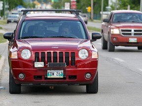 Wise-Up Winnipeg claims city police officers are hassling its volunteers to keep them from alerting motorists to the presence of mobile enforcement units and photo-radar vans. One volunteer says a cop even threatened to try to charge him. (BRIAN DONOGH/Winnipeg Sun files)